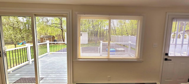 doorway to outside featuring a wealth of natural light