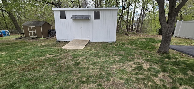 view of shed with fence