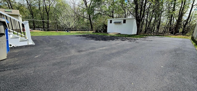 exterior space featuring a storage unit and an outdoor structure