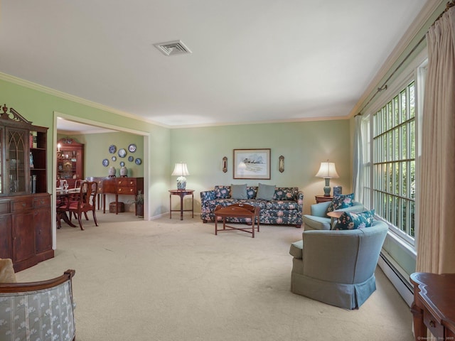 carpeted living area with a baseboard heating unit, ornamental molding, and baseboards