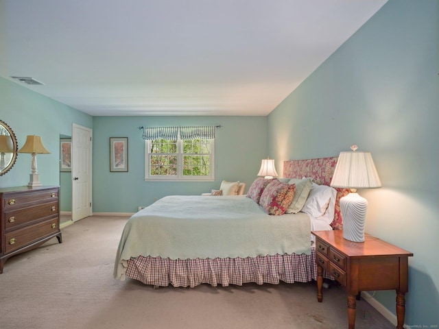 carpeted bedroom featuring baseboards