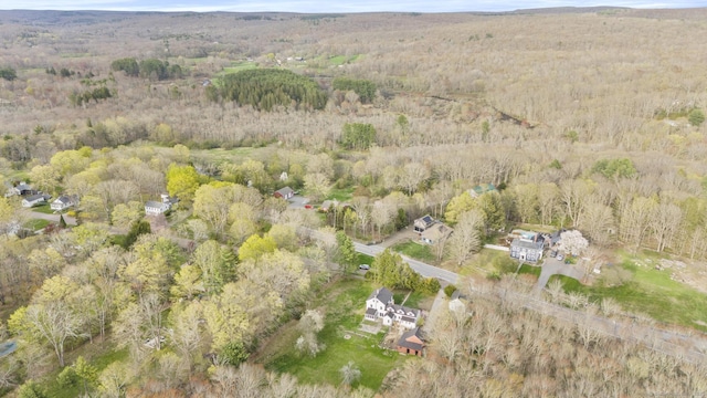 drone / aerial view with a view of trees