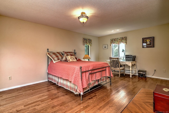 951 Heritage Vlg Unit B, Southbury, CT 06488 - bedroom with wood finished floors and a textured ceiling