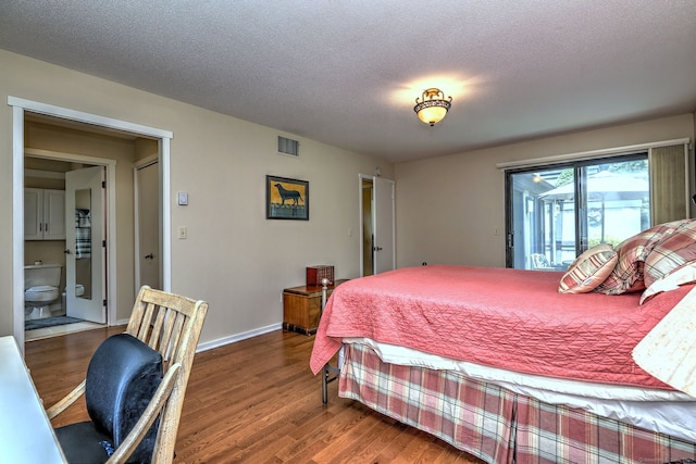 951 Heritage Vlg Unit B, Southbury, CT 06488 - bedroom featuring wood finished floors, access to exterior, and a textured ceiling