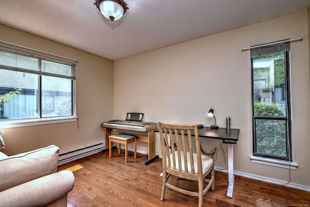 951 Heritage Vlg Unit B, Southbury, CT 06488 - home office with a baseboard radiator, healthy amount of natural light, and wood finished floors