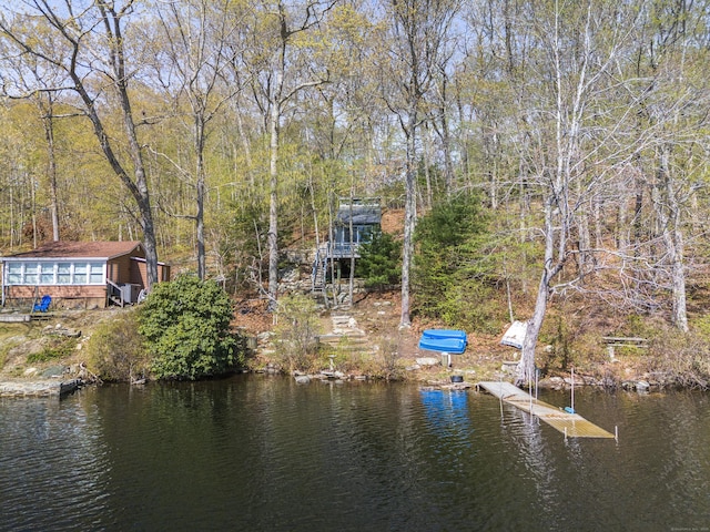 exterior space with a dock and stairway