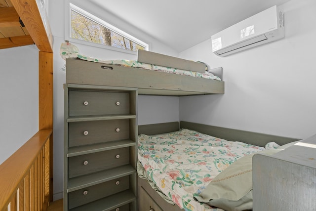 bedroom featuring an AC wall unit