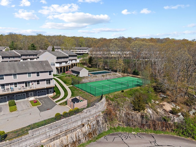 drone / aerial view featuring a forest view