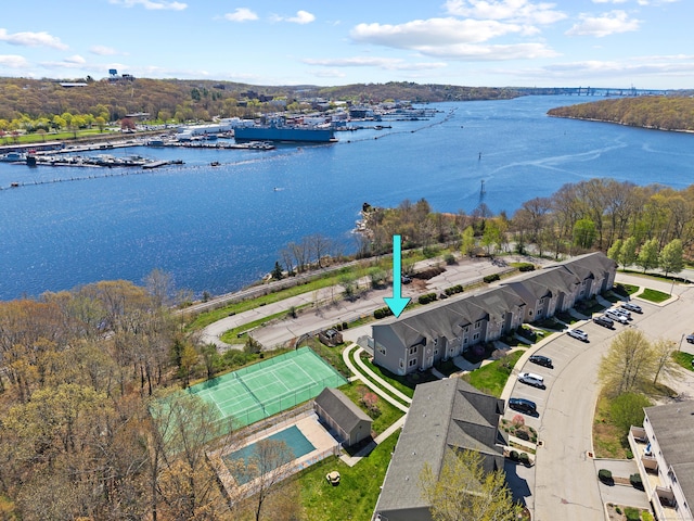 birds eye view of property with a water view