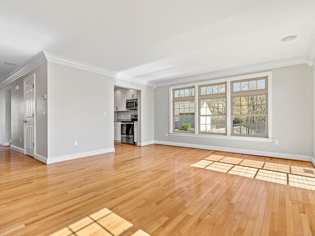 unfurnished living room featuring light wood-style floors, baseboards, and ornamental molding