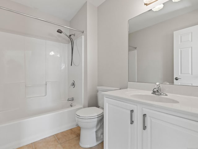 bathroom featuring toilet, bathing tub / shower combination, tile patterned flooring, and vanity