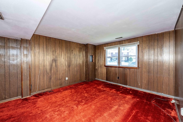185 Daniel Rd, Hamden, CT 06517 - carpeted empty room with wood walls and visible vents