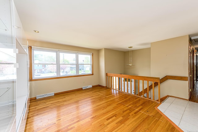 185 Daniel Rd, Hamden, CT 06517 - spare room with light wood-style floors, baseboards, and visible vents