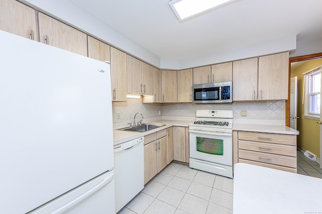 185 Daniel Rd, Hamden, CT 06517 - kitchen with a sink, light brown cabinetry, light tile patterned floors, and white appliances