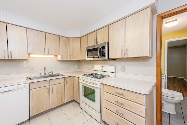 185 Daniel Rd, Hamden, CT 06517 - kitchen featuring white appliances, light tile patterned floors, a sink, and light brown cabinets