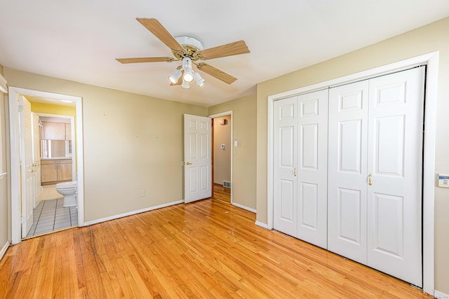 185 Daniel Rd, Hamden, CT 06517 - unfurnished bedroom with a ceiling fan, baseboards, a closet, light wood finished floors, and connected bathroom