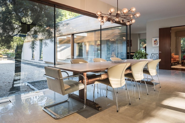 dining room with visible vents and a chandelier