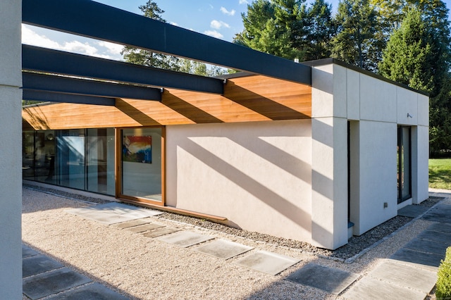 exterior space featuring stucco siding