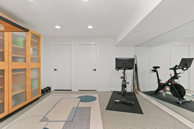 workout room featuring recessed lighting