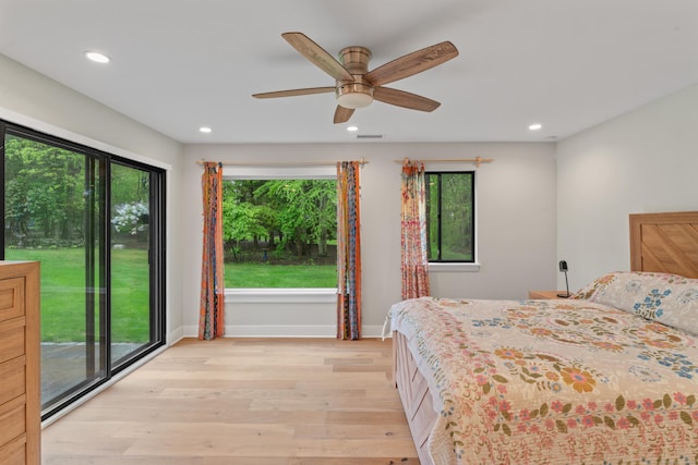bedroom with light wood-type flooring, recessed lighting, baseboards, and ceiling fan