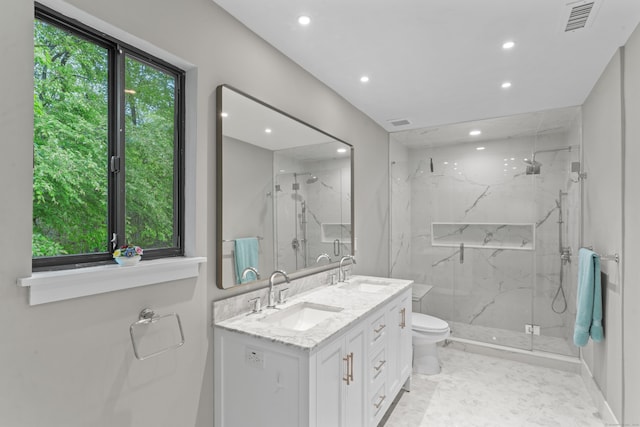 full bathroom featuring recessed lighting, a marble finish shower, toilet, and double vanity
