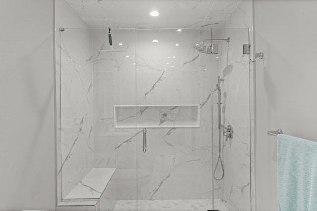 full bathroom featuring a marble finish shower and recessed lighting
