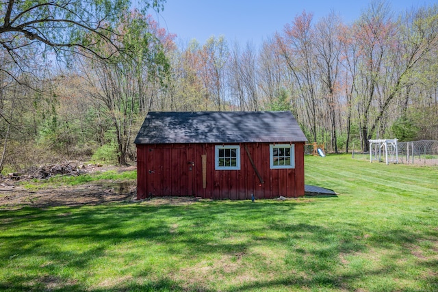 view of shed with a forest view