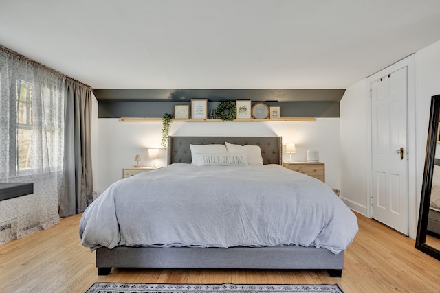 bedroom featuring light wood finished floors