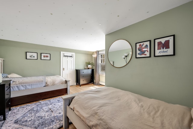bedroom featuring light wood finished floors