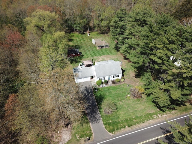 drone / aerial view featuring a view of trees