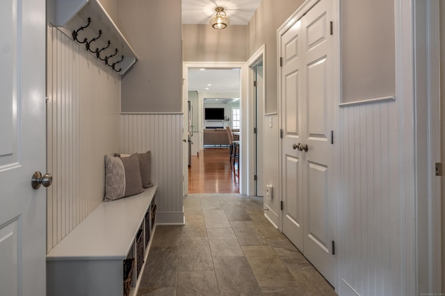 mudroom featuring wainscoting