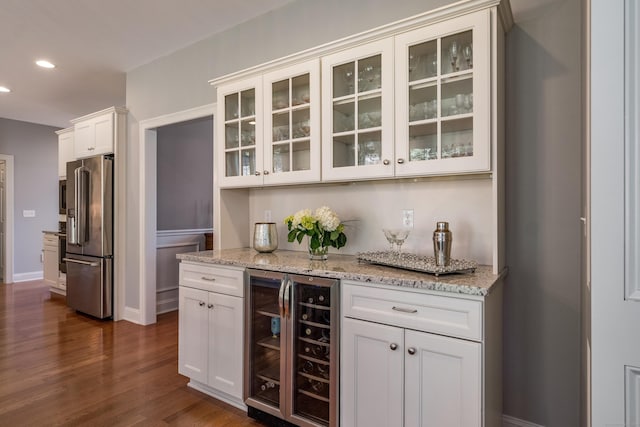 bar featuring high quality fridge, baseboards, dark wood-style floors, beverage cooler, and recessed lighting