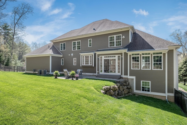 back of property featuring a lawn, a patio area, fence, cooling unit, and entry steps