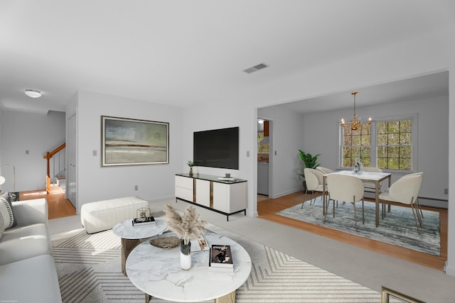 4 Davis Farm Rd, Clinton, CT 06413 - living room featuring a chandelier, stairs, a baseboard radiator, and baseboards
