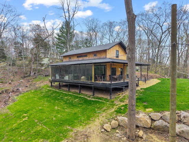 32 Cream Pot Rd, Clinton, CT 06413 - rear view of property with a sunroom, a wooden deck, and a yard
