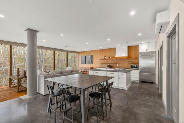 32 Cream Pot Rd, Clinton, CT 06413 - dining room featuring recessed lighting and a wall mounted air conditioner