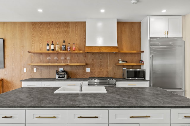 32 Cream Pot Rd, Clinton, CT 06413 - kitchen with wall chimney range hood, dark countertops, appliances with stainless steel finishes, open shelves, and a sink