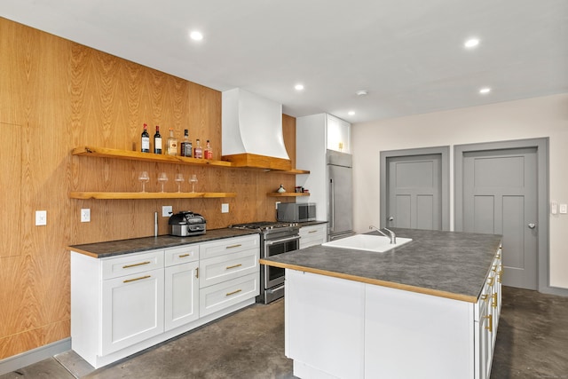32 Cream Pot Rd, Clinton, CT 06413 - kitchen with dark countertops, appliances with stainless steel finishes, a sink, and custom range hood