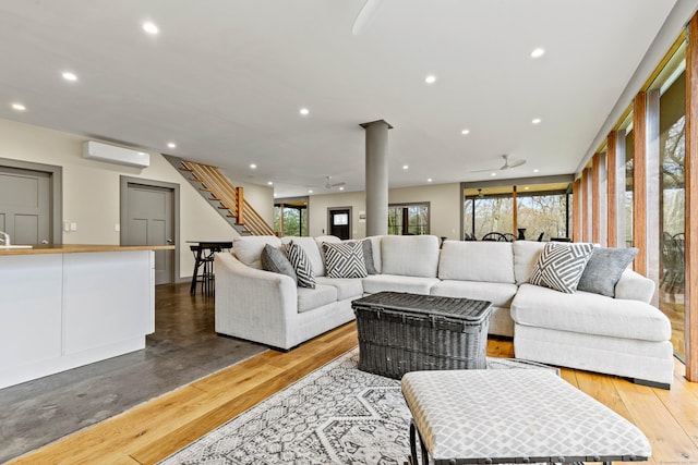 32 Cream Pot Rd, Clinton, CT 06413 - living area featuring wood-type flooring, decorative columns, ceiling fan, recessed lighting, and a wall unit AC