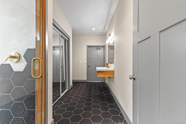 32 Cream Pot Rd, Clinton, CT 06413 - hall featuring dark tile patterned floors, baseboards, and recessed lighting
