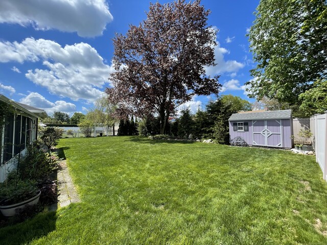 view of yard with a shed and an outdoor structure