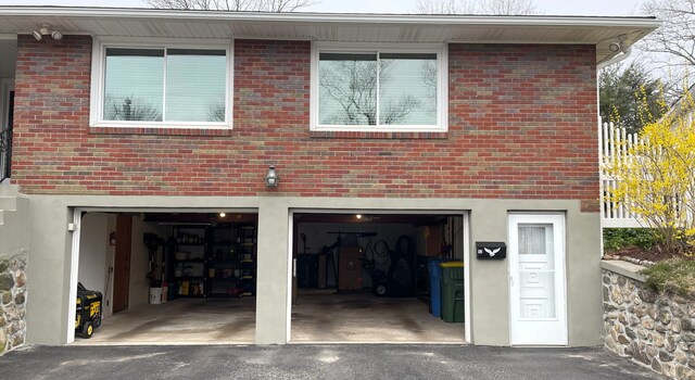 garage featuring driveway