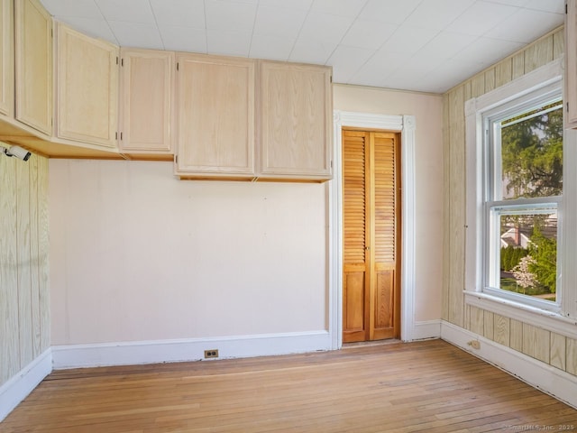 interior space with a healthy amount of sunlight, baseboards, and light wood finished floors