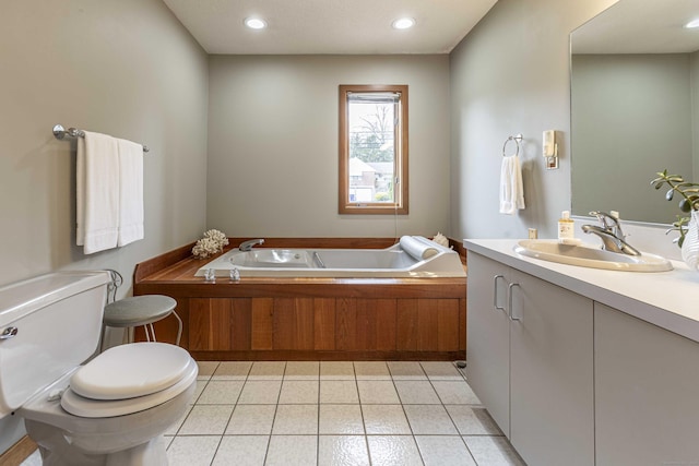 bathroom with recessed lighting, vanity, a bath, toilet, and tile patterned flooring