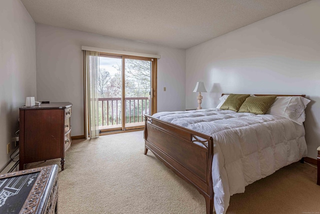bedroom with a textured ceiling, access to outside, carpet floors, and baseboards