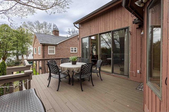 deck with outdoor dining area