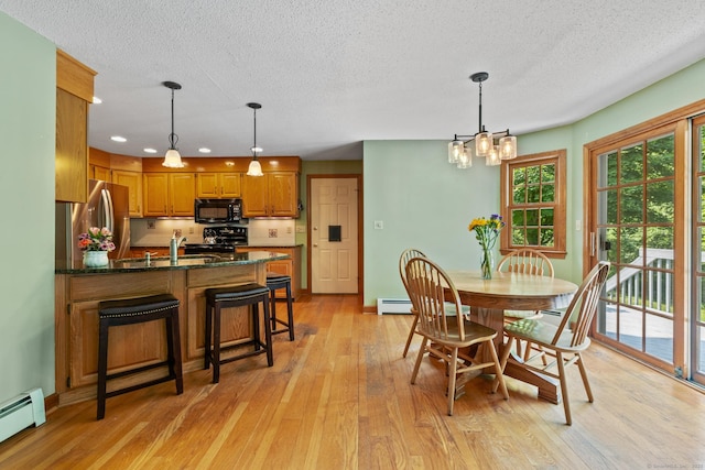 199 Dennison Rdg, Manchester, CT 06040 - dining area with a baseboard heating unit, light wood finished floors, a textured ceiling, a chandelier, and recessed lighting