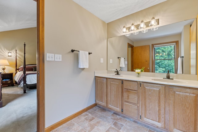 199 Dennison Rdg, Manchester, CT 06040 - ensuite bathroom featuring double vanity and baseboards