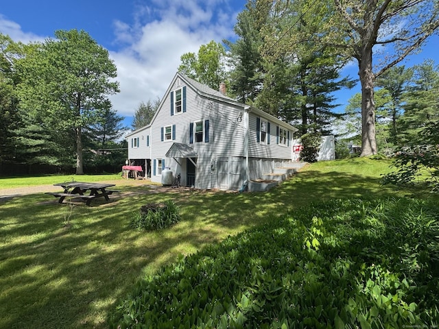 17 Green Rd, Vernon, CT 06066 - view of side of property featuring a chimney and a lawn