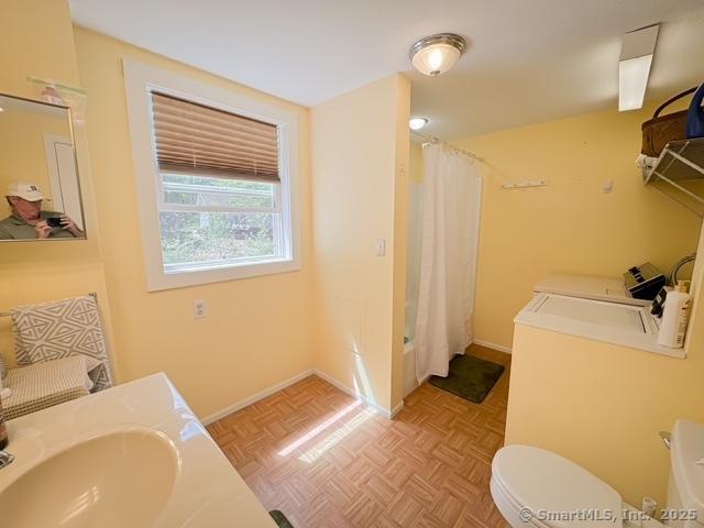 17 Green Rd, Vernon, CT 06066 - bathroom with toilet, a shower with curtain, washing machine and clothes dryer, and vanity